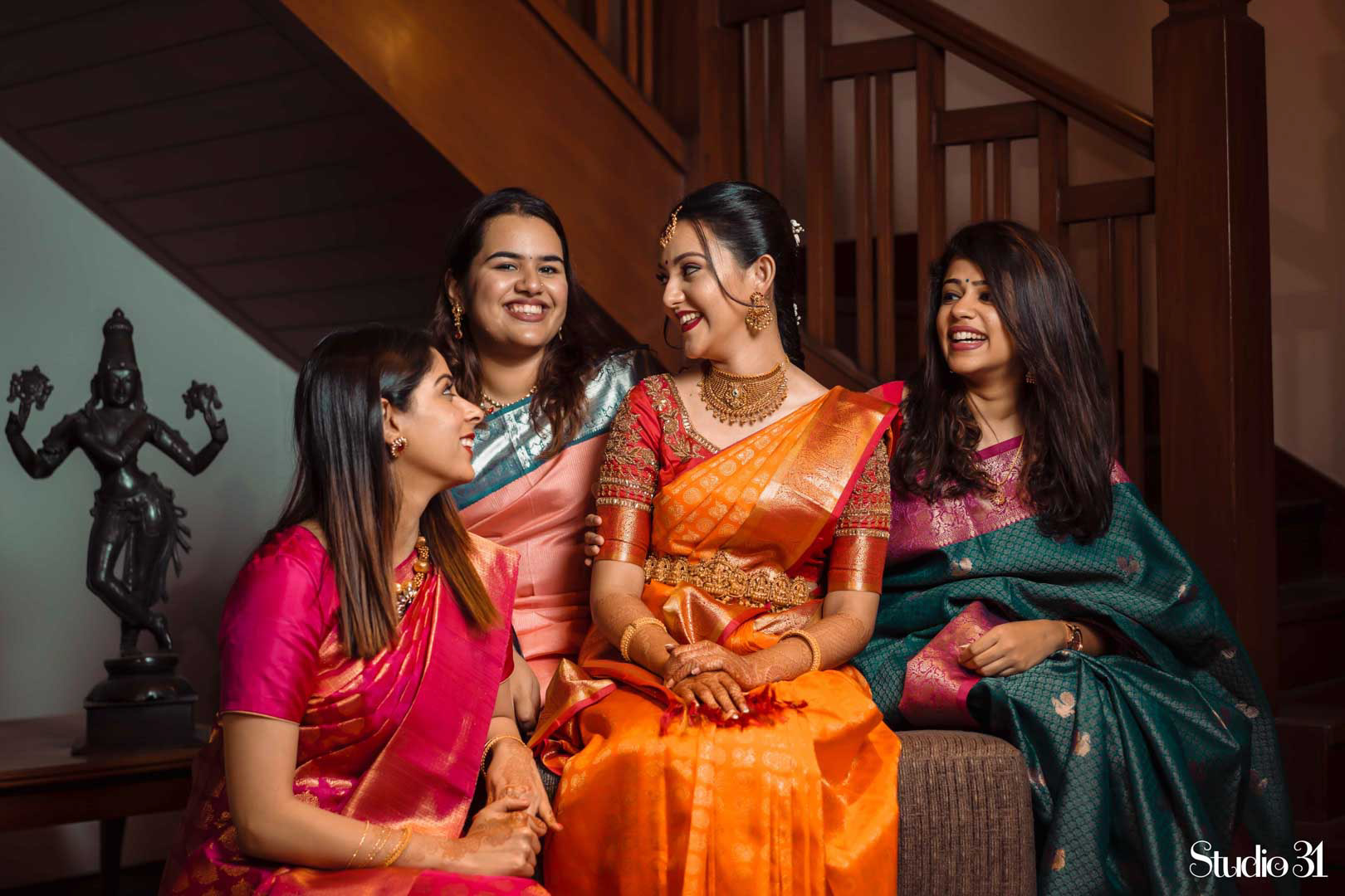 Candid photography of a bride and her bridesmaids at Taj Connemara, Chennai