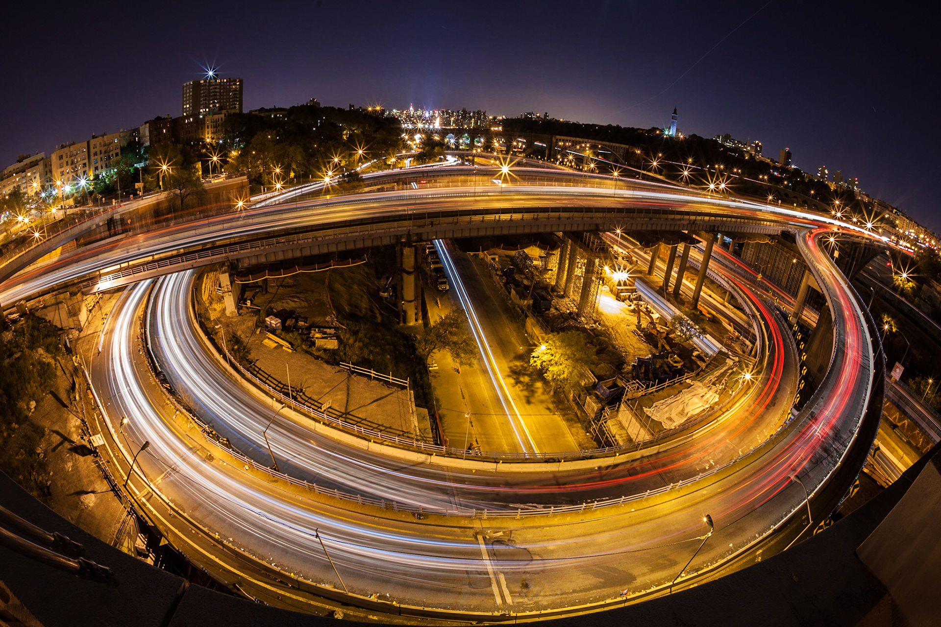 At the intersection of Major Deegan Expressway and the Cross Bronx Expressway in the Bronx of New York City. The image was taken with a fisheye lens.