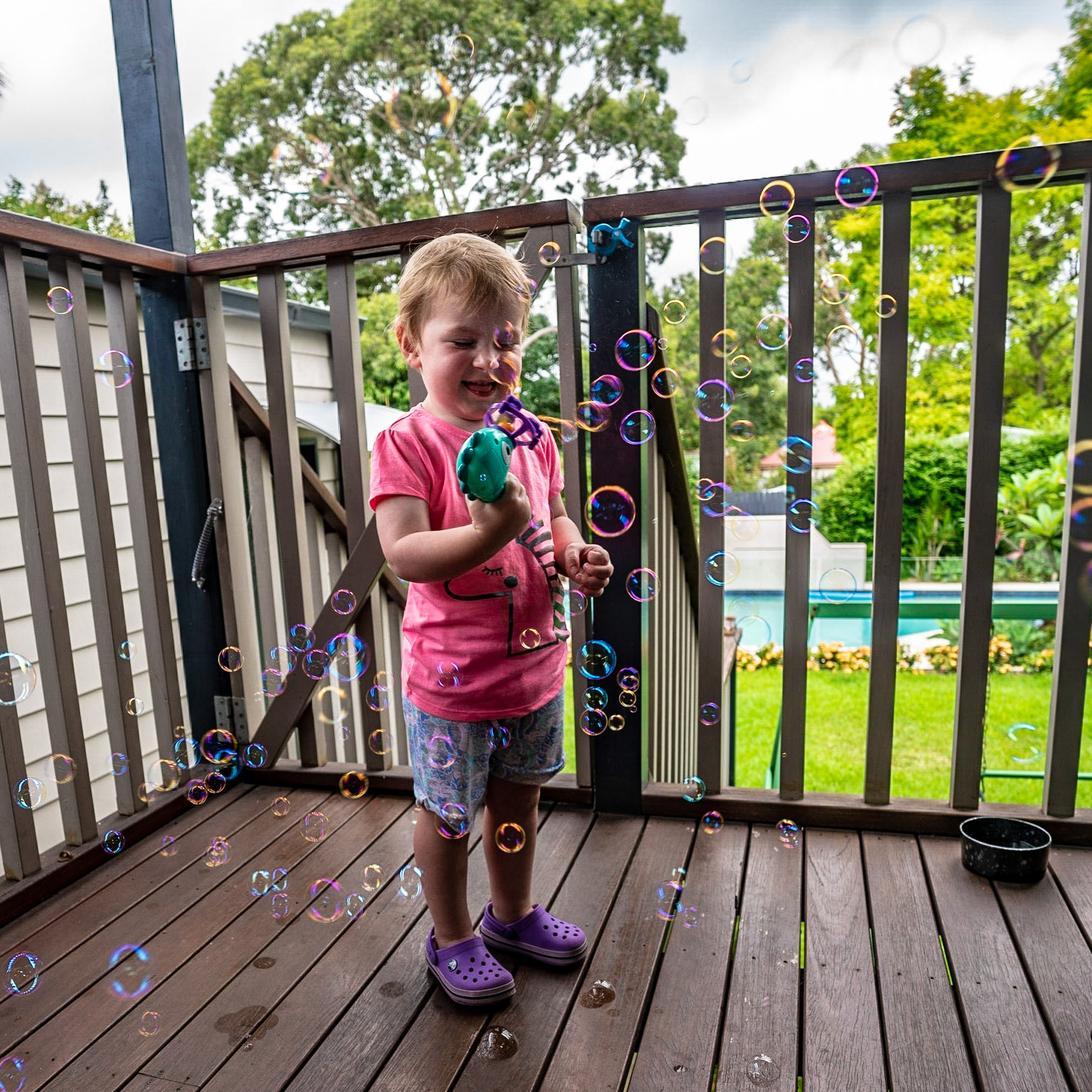 Went to Alex and Lisa's house for dinner this evening. Their daughter Jessie got a new toy - a bubble blowing machine which she loved