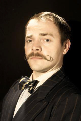 Adam with a curly mustache
