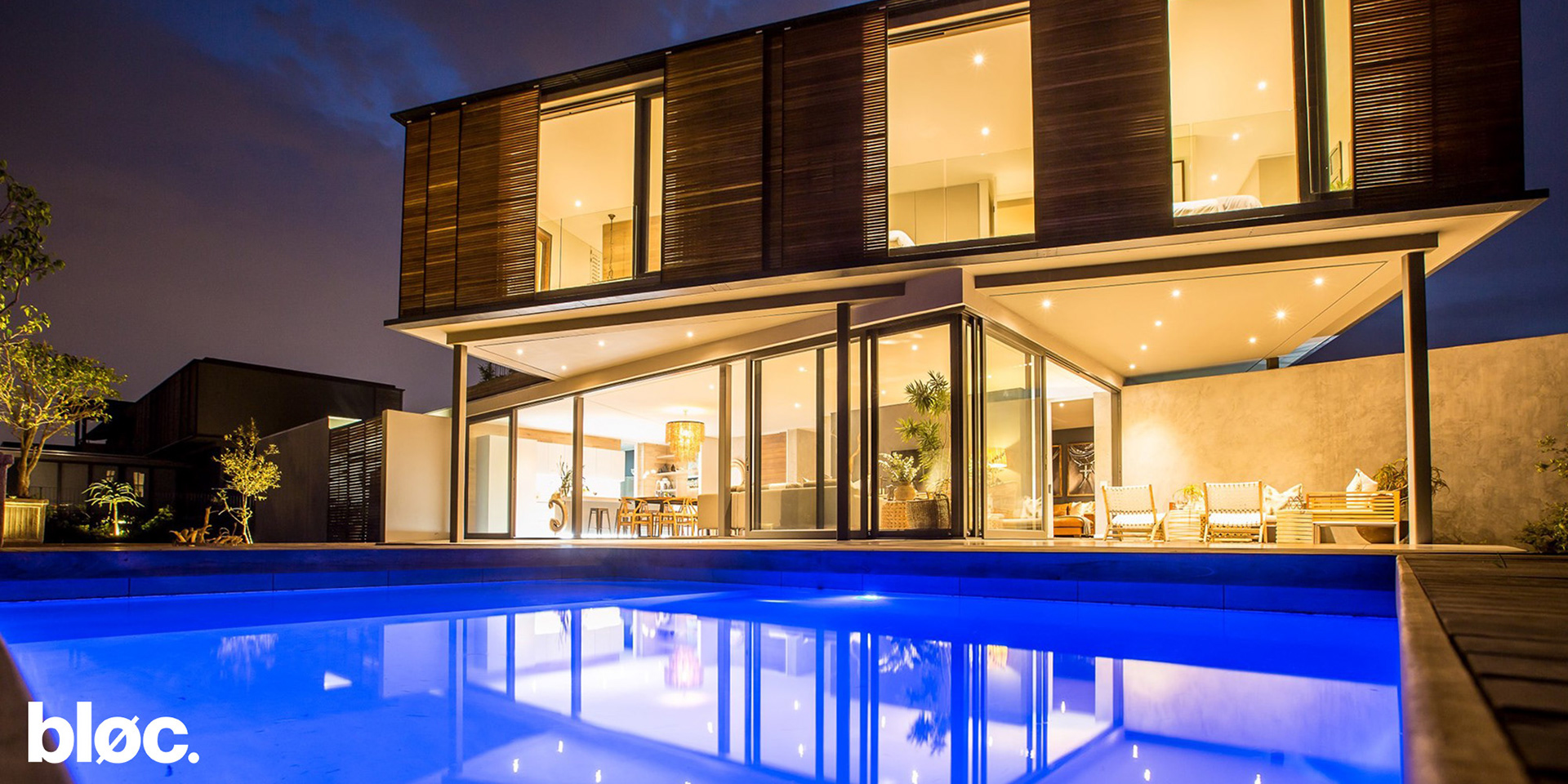 Modern double storey home with sliding timber screens