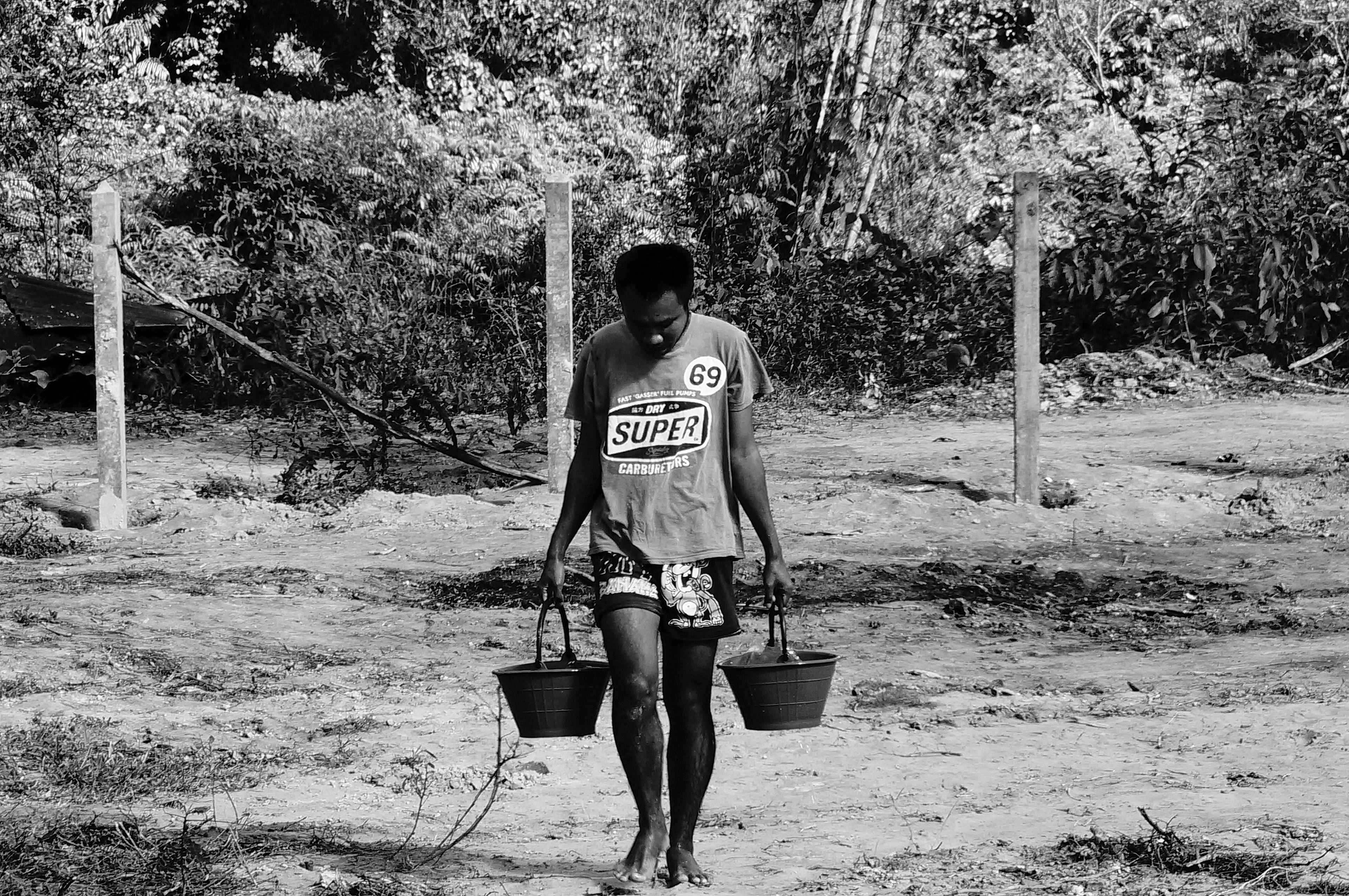 One of the beneficiary of the Transformation Center working on a building site, Laos, December 2017