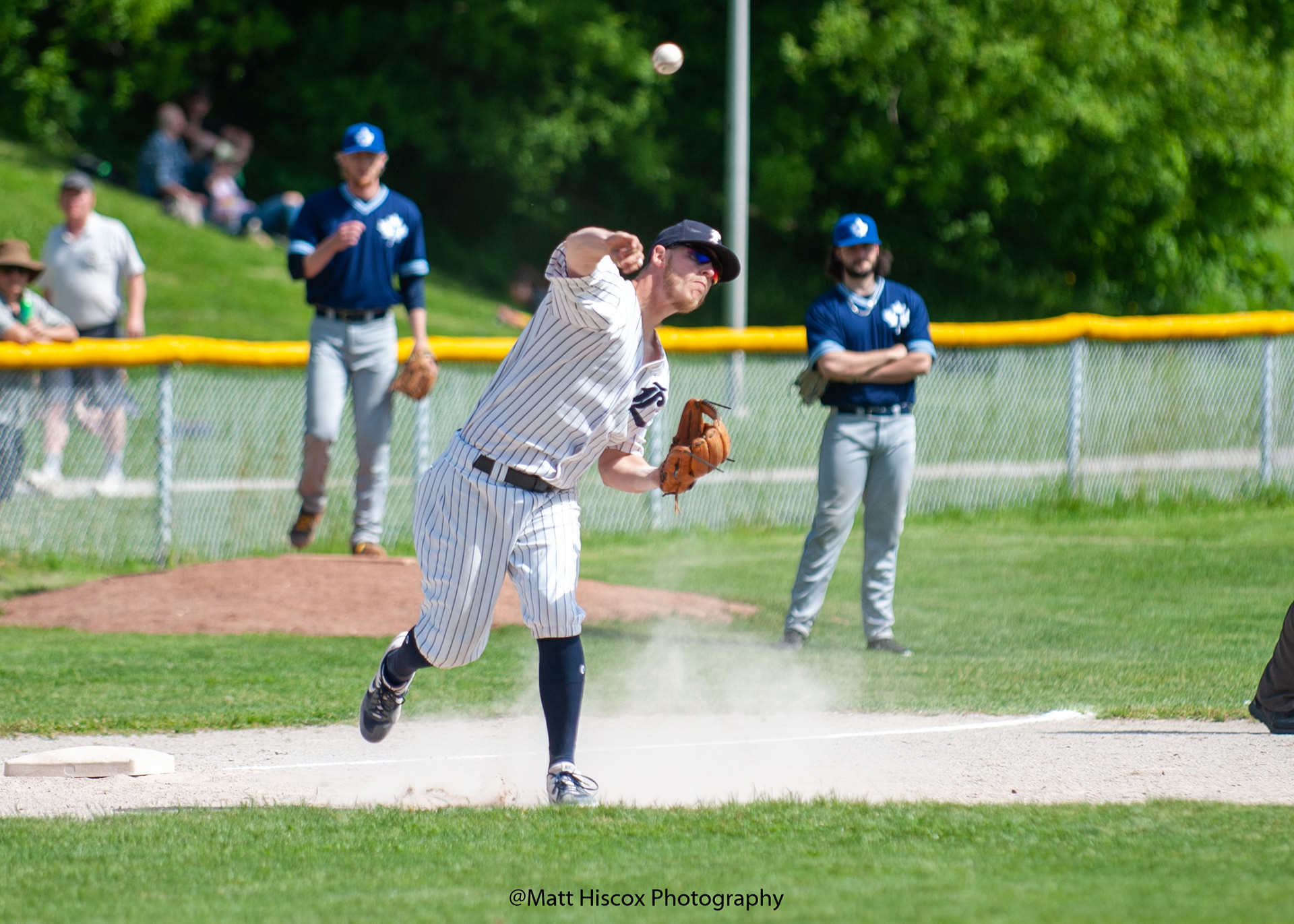Mike Ambrose throws to first