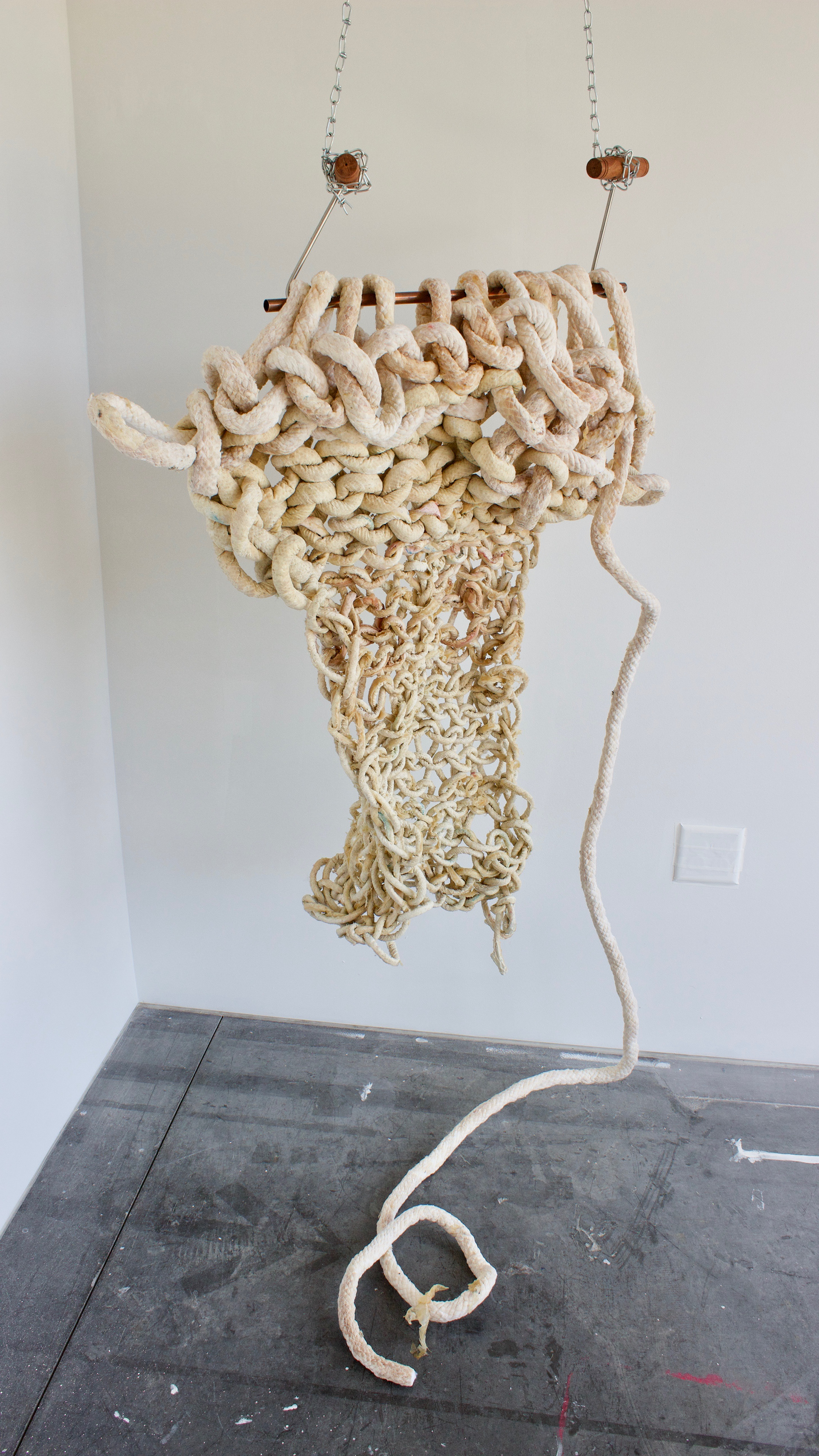 sculptural remnants from an hour and forty minute long performance. Arm knitting latex cord