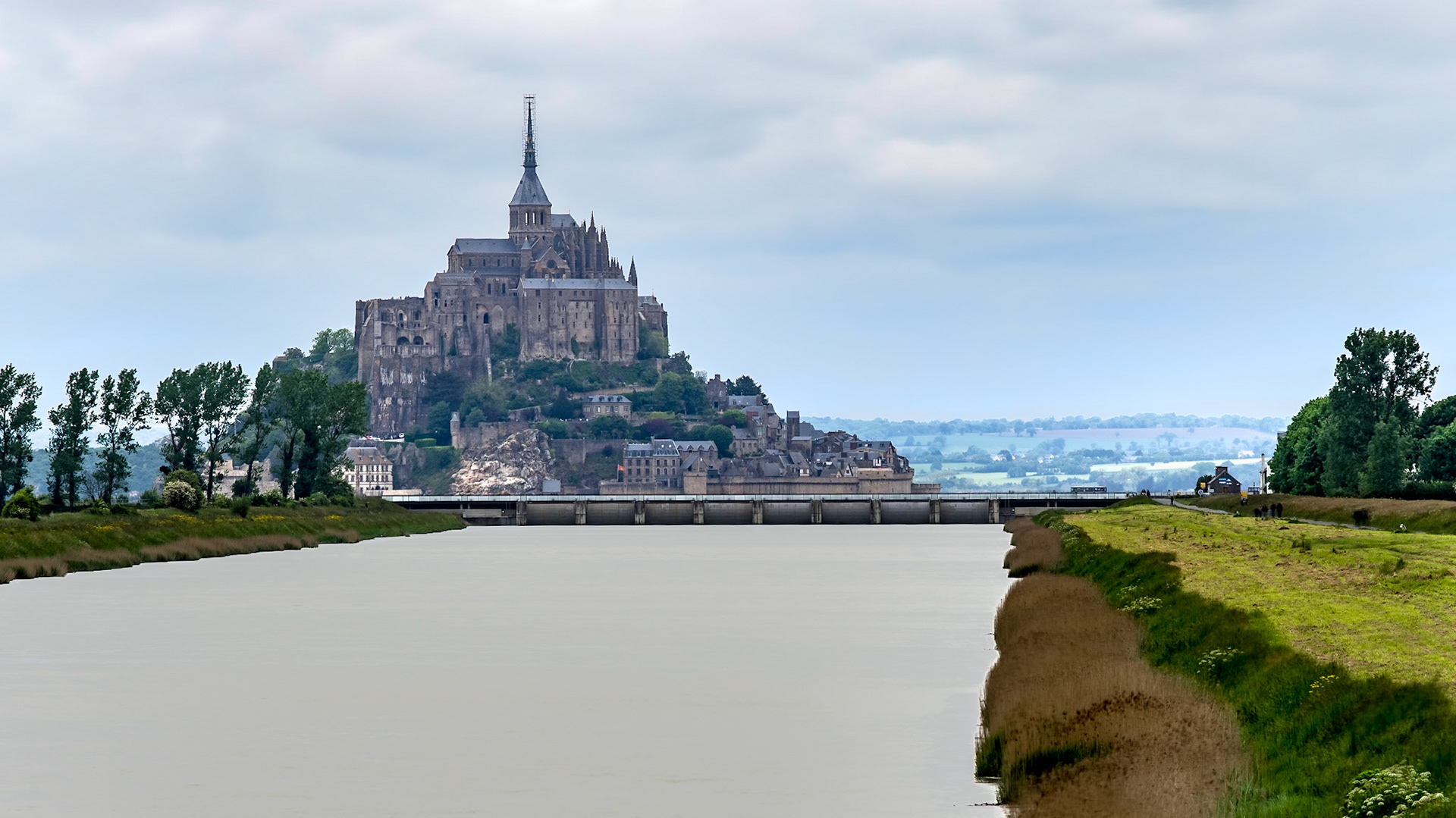 View on the new dam at Mont Saint-Michel, from the bridge over the Couesnon channel in Beauvoir, Normandy.