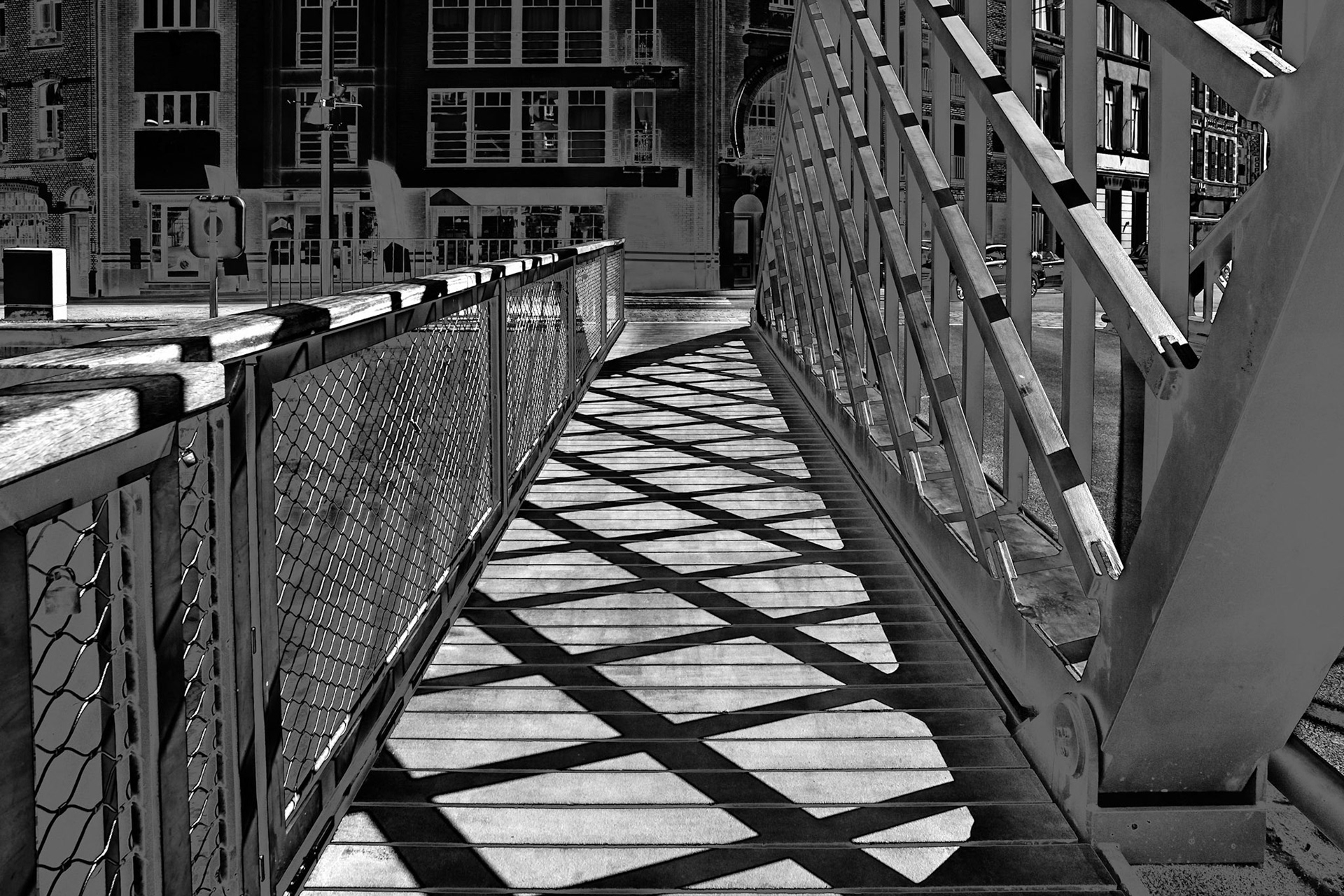 Crossing patterns on a bridge over the Oude Dender in the city of Dendermonde, Flnaders.