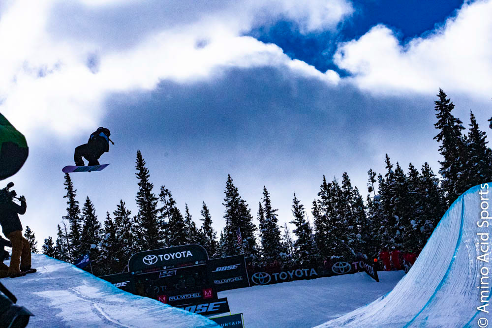 USA's Maddie Mastro takes her Run 1 north of the border with a 540* canadian bacon grab tween the legs.