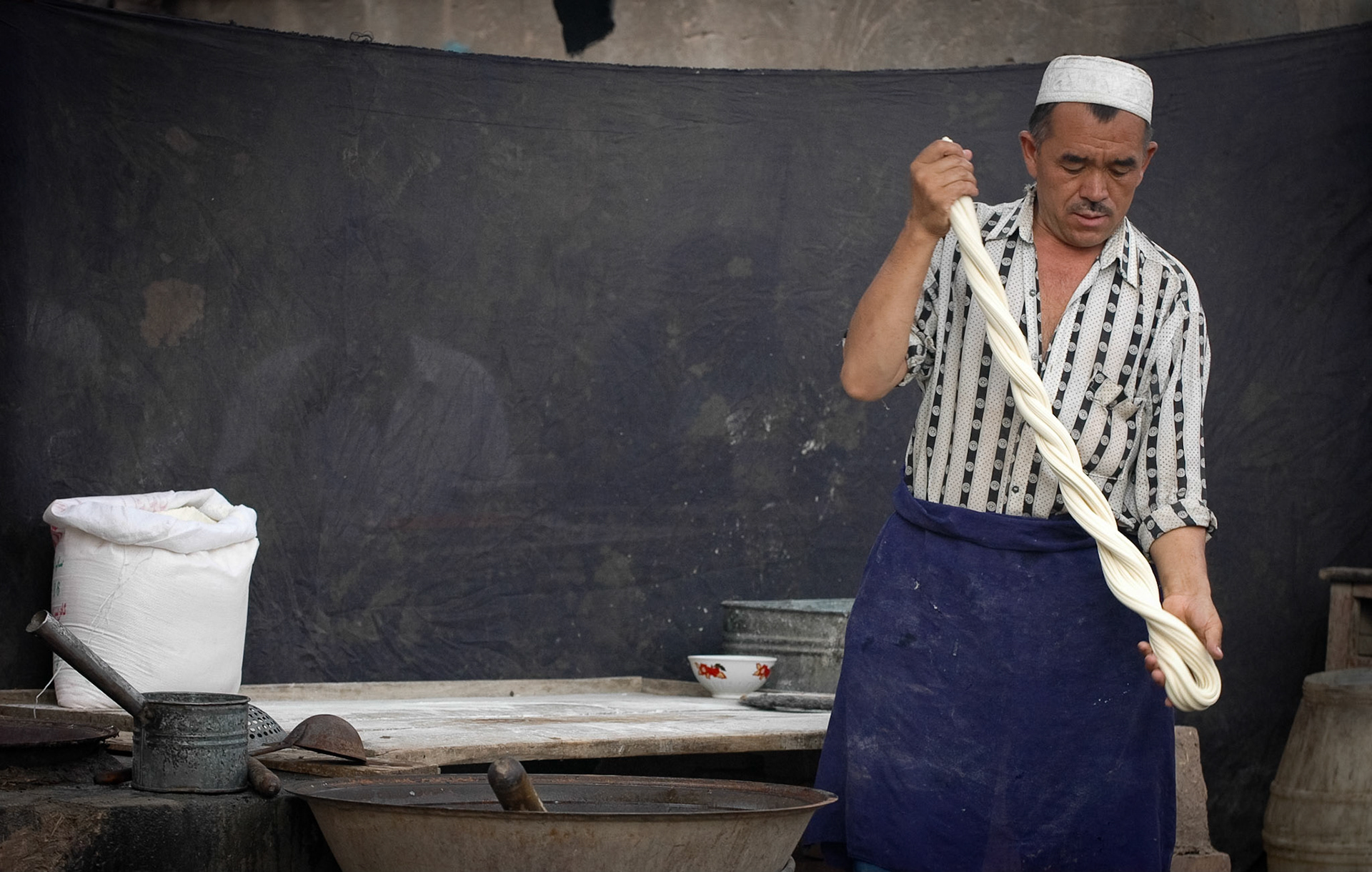 Stand keeper at Mal Bazaar (Kashgar, China)