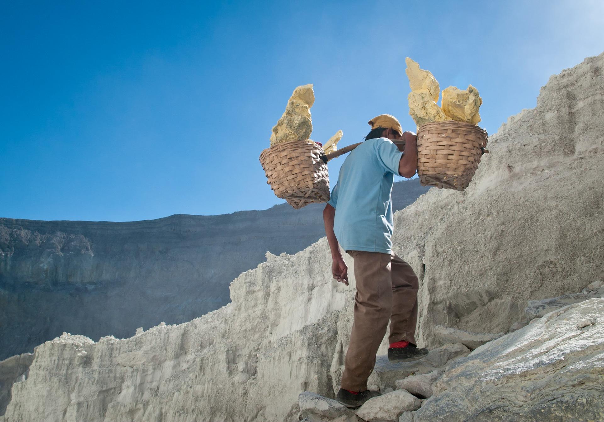 Porter climbing out of the crater (Kawah Ijen, Java, Indonesia)