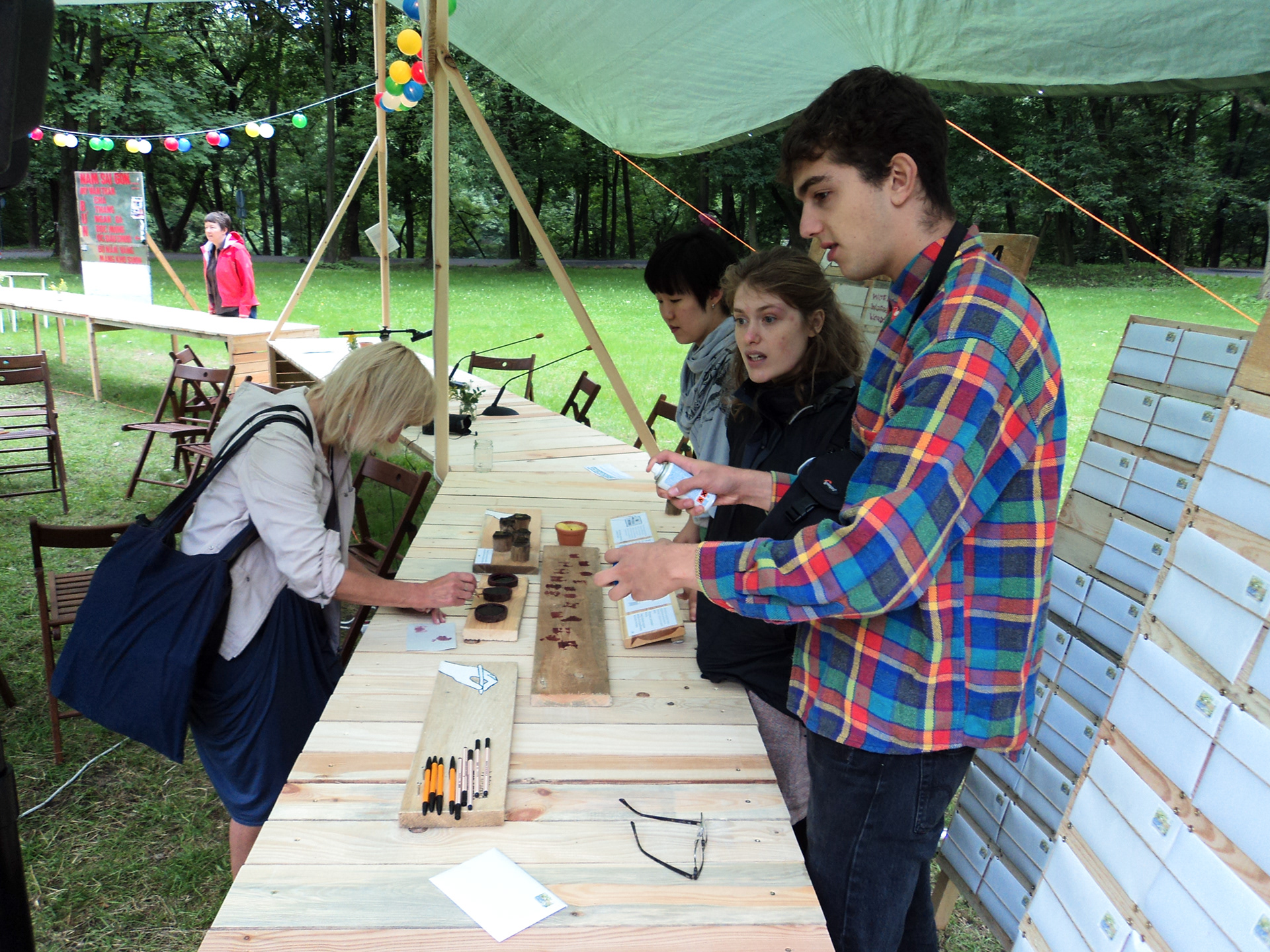 Photograph of person writing a story using the beetroot ink 1