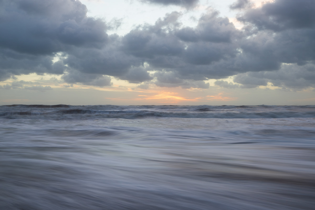Seascape in the sunset and cloudy sky